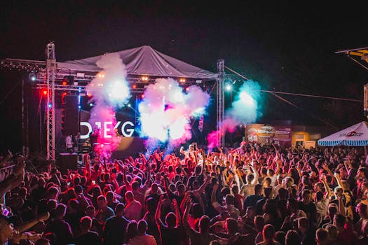 Lively outdoor music festival with vibrant lights, crowd energy, and a dynamic performance.